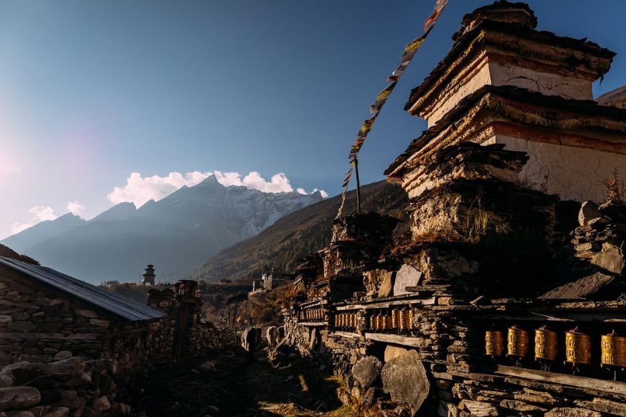 Buddhist stupas with Manaslu mountain views